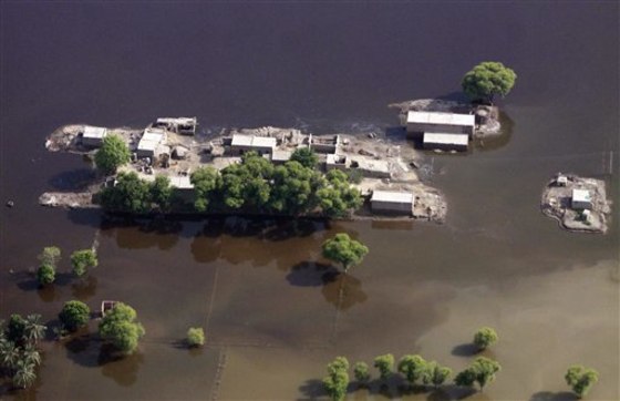 An aerial view shows floodwaters surround houses in the Rajanpur district of Punjab province, Pakistan on Sunday. Floodwaters are still swamping rich agricultural land in the southern provinces of Sindh and Punjab weeks after it lashed the country, killing about 1,600 and leaving about 20 million people affected by floods.